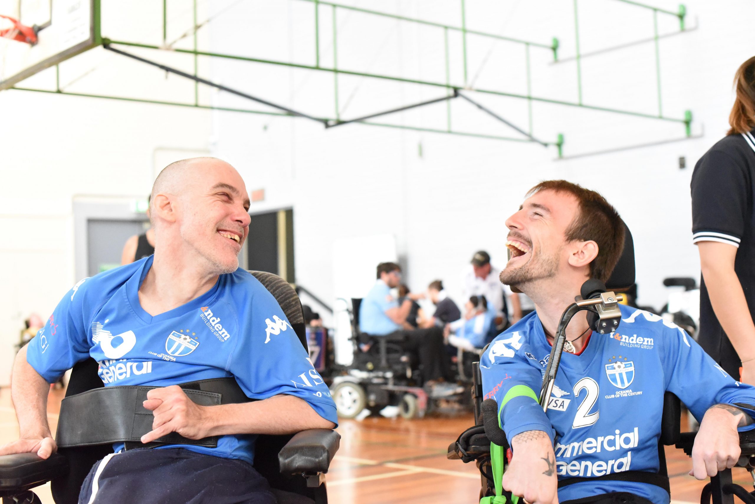 Craig Kilby (Left) smiling with South Melbourne Powerchair teammate Gavin Thornycroft (Right)